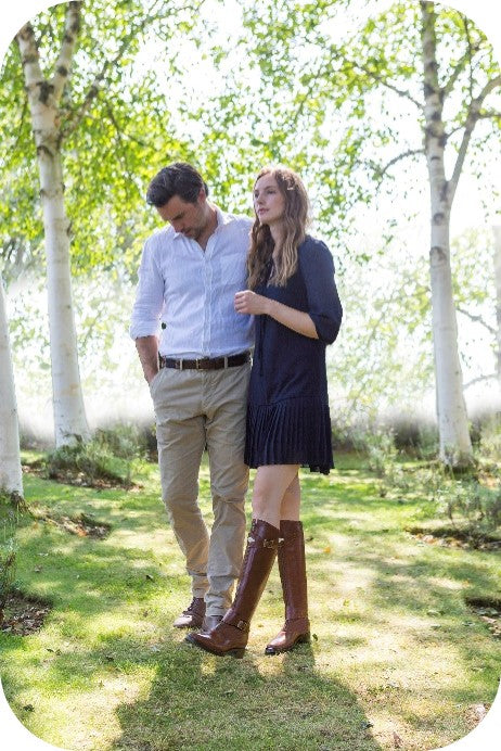 two people walking in the trees